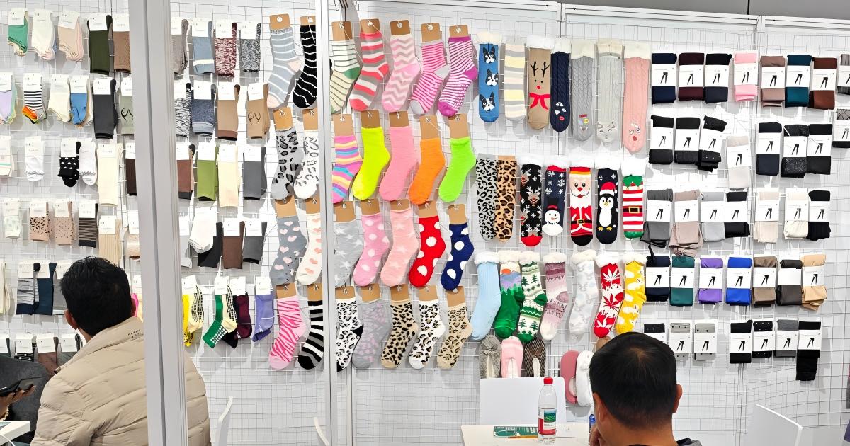 Diverse collection of wholesale socks displayed at trade show | Winjet Socks