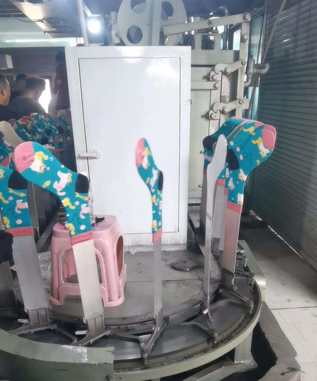 Custom socks on shaping machine at Winjet Socks factory in Zhuji, China